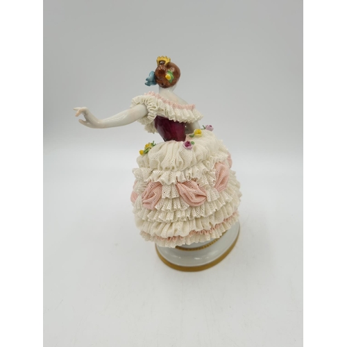 1143 - A Volkstedt porcelain lace figurine - approx. 20cm high