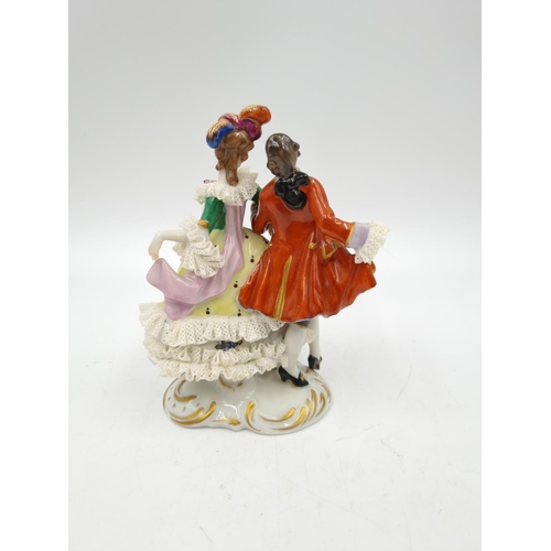 1148 - A Volkstedt porcelain lace figurine - approx. 13cm high