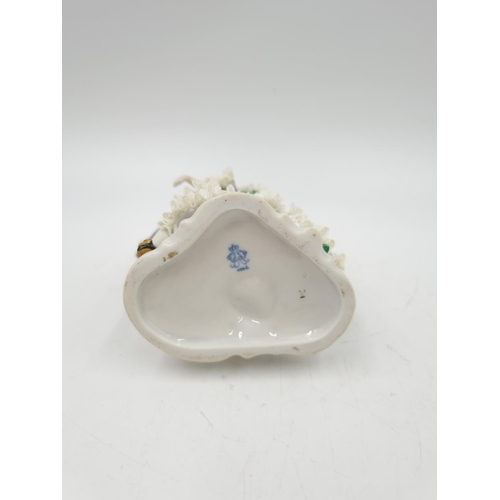 1148 - A Volkstedt porcelain lace figurine - approx. 13cm high