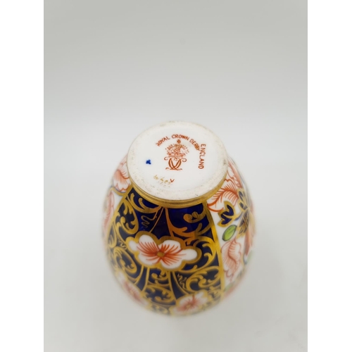 1153 - Two pieces of Royal Crown Derby Old Imari china comprising 11.5cm bud vase and miniature tea cup