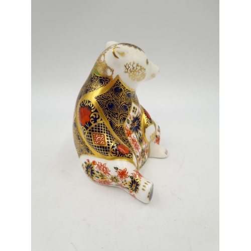 1157 - A Royal Crown Derby Honey Bear paperweight with silver stopper - approx. 10cm high