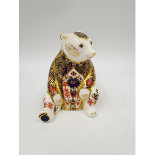 1157 - A Royal Crown Derby Honey Bear paperweight with silver stopper - approx. 10cm high