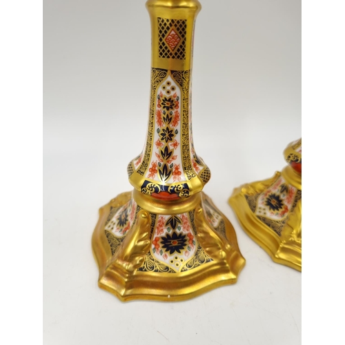 1159 - A pair of Royal Crown Derby Old Imari candlesticks - approx. 18cm high