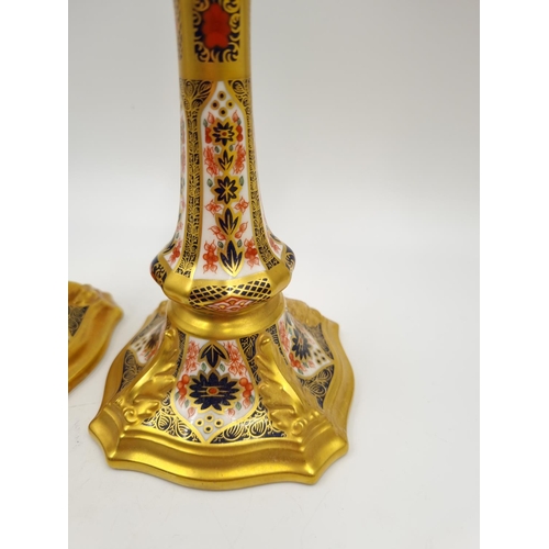 1159 - A pair of Royal Crown Derby Old Imari candlesticks - approx. 18cm high