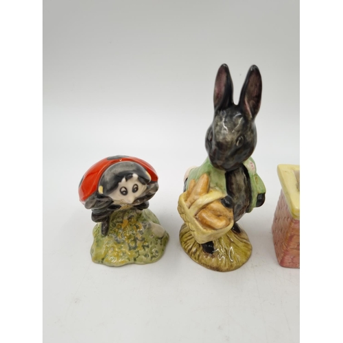 1172 - Four Royal Albert Beatrix Potter figurines comprising Tom Thumb, Little Black Rabbit, Mother Ladybir... 