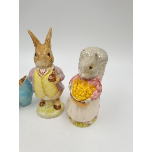 1173 - Four Beswick Beatrix Potter figurines comprising Mr Benjamin Bunny, The Old Woman who lived in a Sho... 