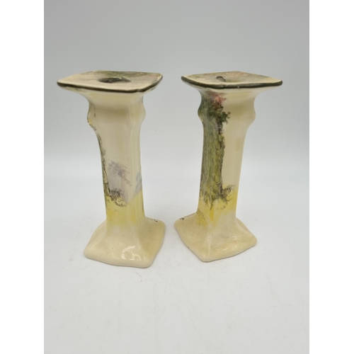 1186 - A pair of Royal Doulton Under The Greenwood Tree candlesticks - approx. 17cm high