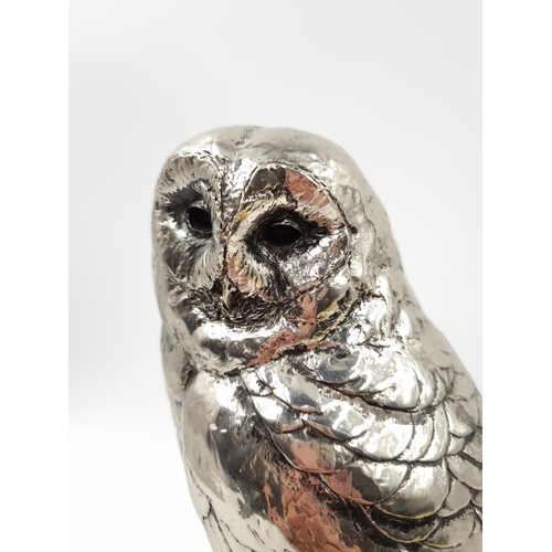 1197 - A Michael Simpson nickel plated resin owl figurine with impressed maker's mark to reverse - approx. ... 