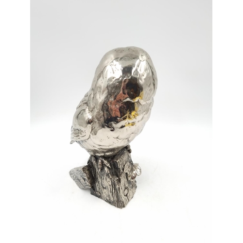 1197 - A Michael Simpson nickel plated resin owl figurine with impressed maker's mark to reverse - approx. ... 