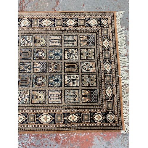 247 - A Persian style brown rug - approx. 160cm x 94cm