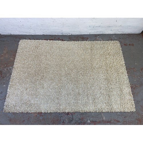 251 - An Essentials Lustrous Ribbon cream rug - approx 200cm x 140cm