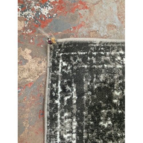 250 - A modern silver and white rug - approx. 294cm x 200cm