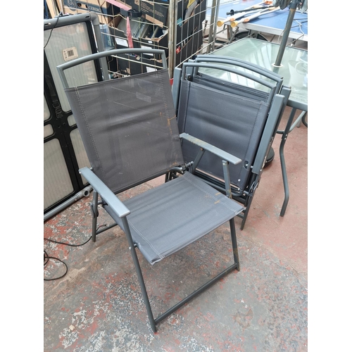 520E - A grey metal six piece patio set comprising square glass topped table - approx. 72cm high x 86cm squ... 