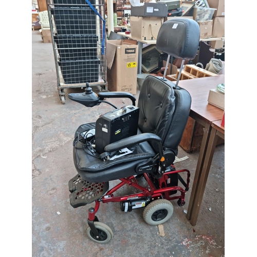 520F - An UltraLite electric mobility chair with two battery packs, battery charger and owners manual