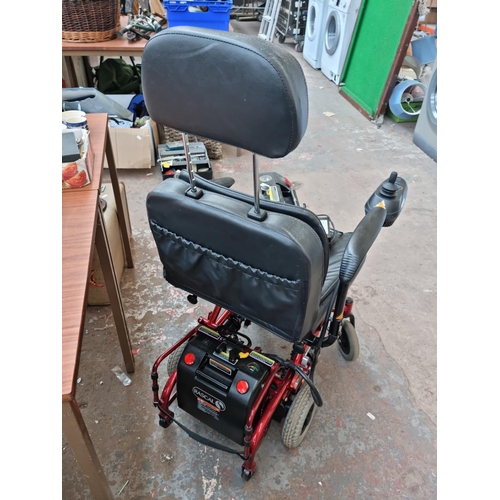 520F - An UltraLite electric mobility chair with two battery packs, battery charger and owners manual