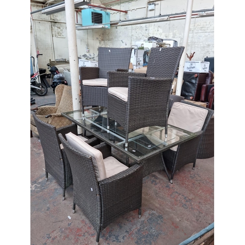 520A - A plastic rattan effect and glass rectangular patio table with six matching chairs - approx. 73cm hi... 