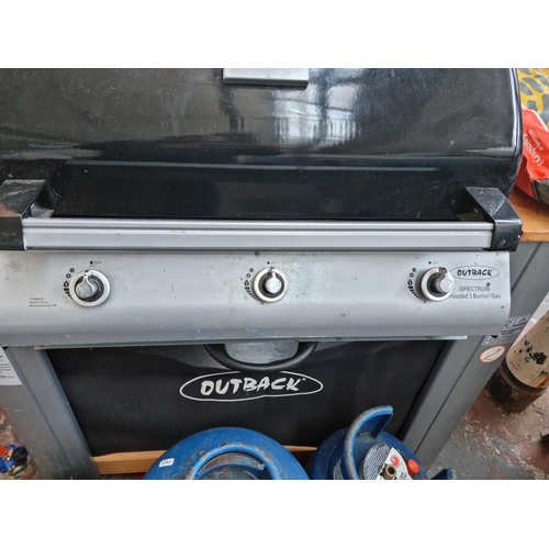 520D - An Outback Spectrum hooded three burner gas barbecue with accessories