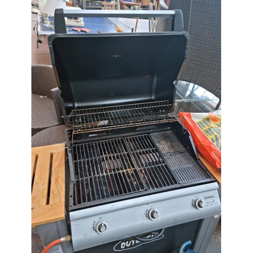 520D - An Outback Spectrum hooded three burner gas barbecue with accessories