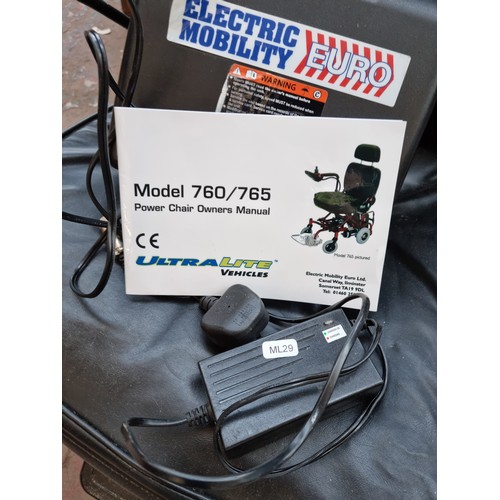 520F - An UltraLite electric mobility chair with two battery packs, battery charger and owners manual