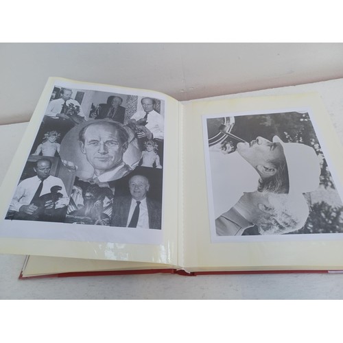 396 - A photo album containing signed film photographs.