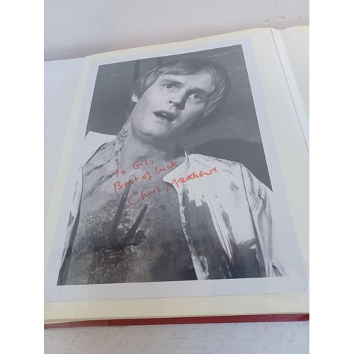 396 - A photo album containing signed film photographs.