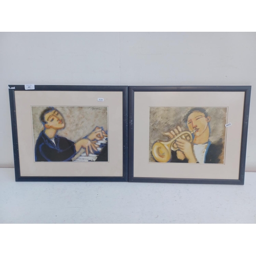 400 - Two music related framed prints, one pianist and one trumpeter