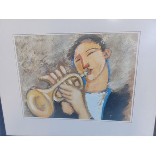 400 - Two music related framed prints, one pianist and one trumpeter