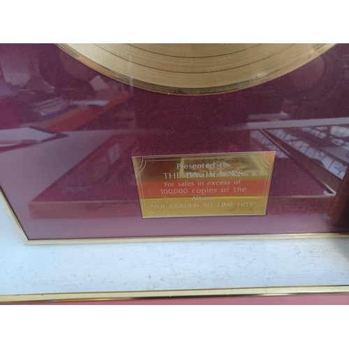 401 - Five framed items, one Decca gold record presented to The Bachelors for sales in excess of 100,00 co... 