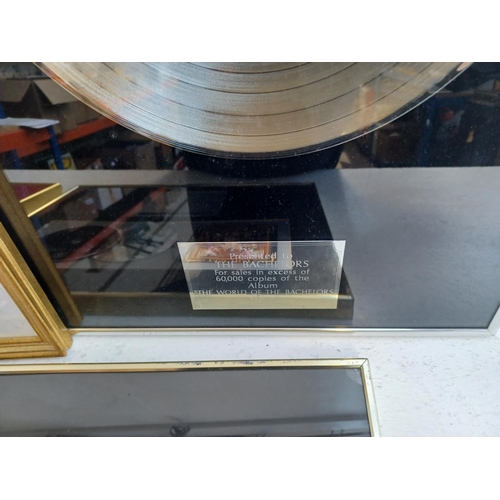 401 - Five framed items, one Decca gold record presented to The Bachelors for sales in excess of 100,00 co... 