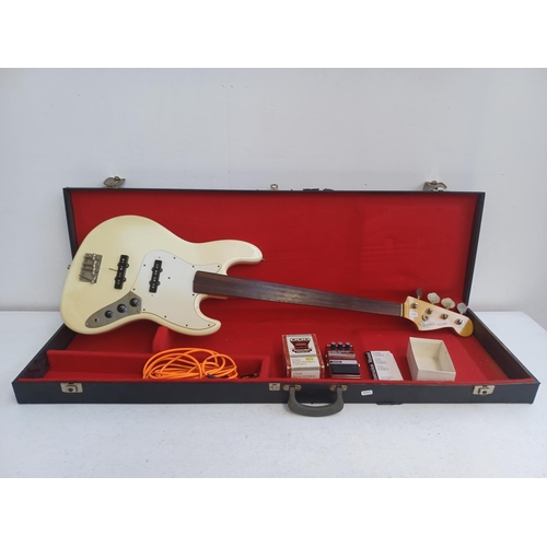 408 - A cased Japanese Fender fretless jazz bass with boxed Dod FX62 bass stereo chorus effects pedal and ... 