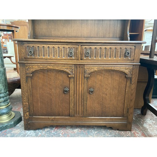 7 - An oak dresser with upper plate rack, two drawers and two lower cupboard doors - approx. 90cm high x... 