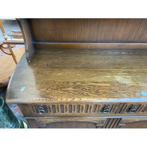 7 - An oak dresser with upper plate rack, two drawers and two lower cupboard doors - approx. 90cm high x... 