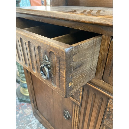 7 - An oak dresser with upper plate rack, two drawers and two lower cupboard doors - approx. 90cm high x... 