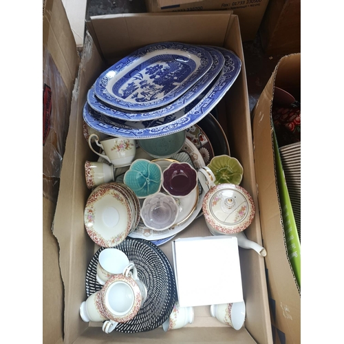 592 - Four boxes and one bag containing a large collection of assorted items to include studio pottery, fr... 