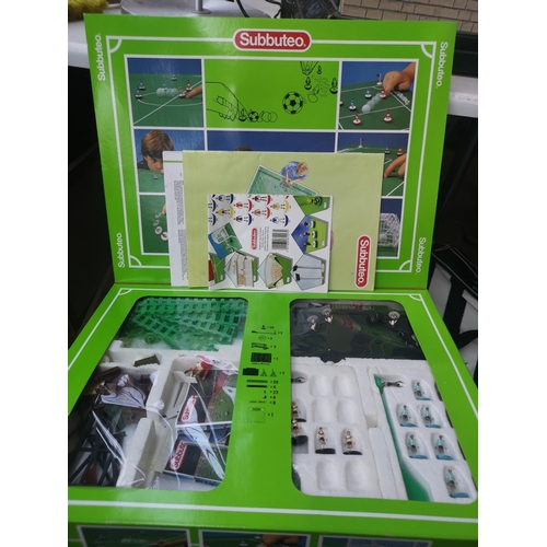 597 - Two boxes containing a large collection of assorted items to include ties, boxed Subbuteo set, toys ... 