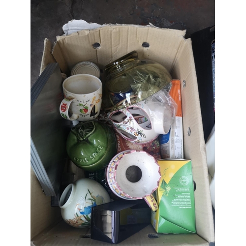 598 - Four boxes containing a collection of assorted items to include Philips iron, weighing scales, DVDs,... 