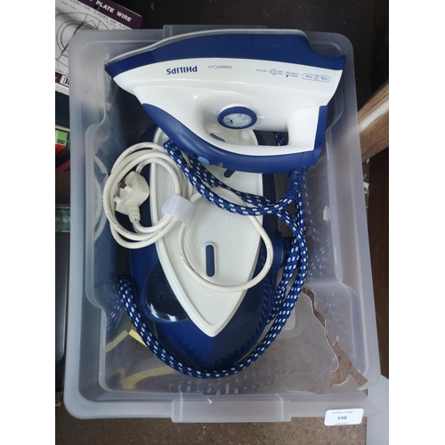 598 - Four boxes containing a collection of assorted items to include Philips iron, weighing scales, DVDs,... 