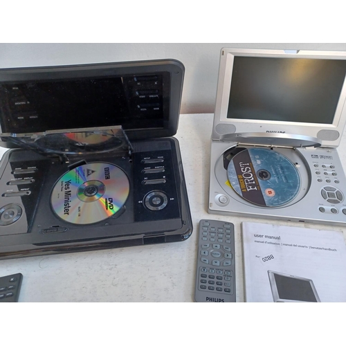 367 - Two portable DVD players, one Philips PET800 with remotes and instruction manual and one HKC with re... 