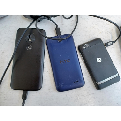 374 - A collection of mobile phones to include Motorola, HTC, Nokia and Samsung.