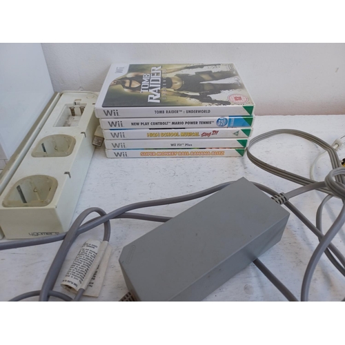 375 - A collection of Nintendo Wii items to include console, charging stand, Wii remotes, power adapter, n... 