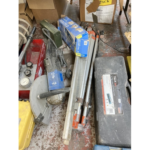 522 - A large collection of assorted tools to include Diaquip 110v circular saw, boxed tile cutters, two f... 