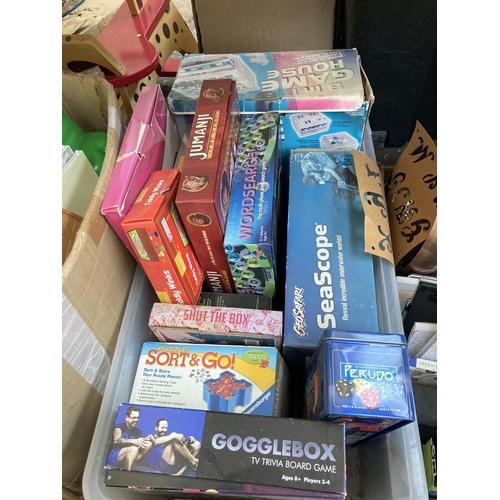 541 - Four boxes containing a large collection of assorted items to include boxed board games, boxed Lego ... 