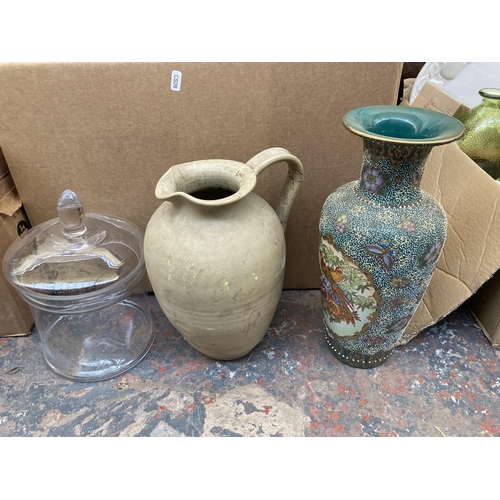 551 - Three boxes containing a large collection of assorted items to include ceramics, glassware, copper w... 