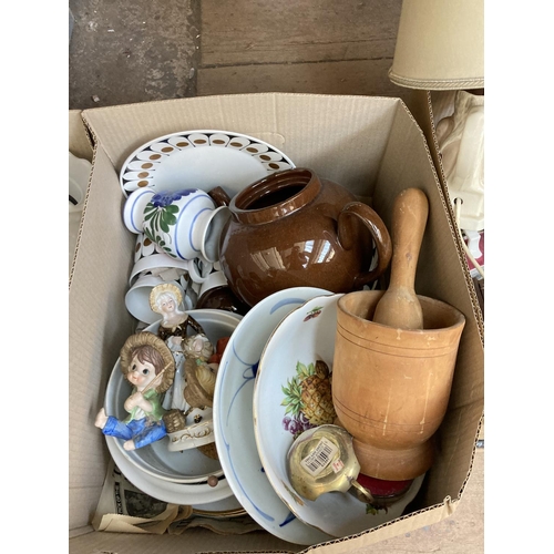 557 - Five boxes containing a large collection of assorted items to include vintage oil lamp with green gl... 