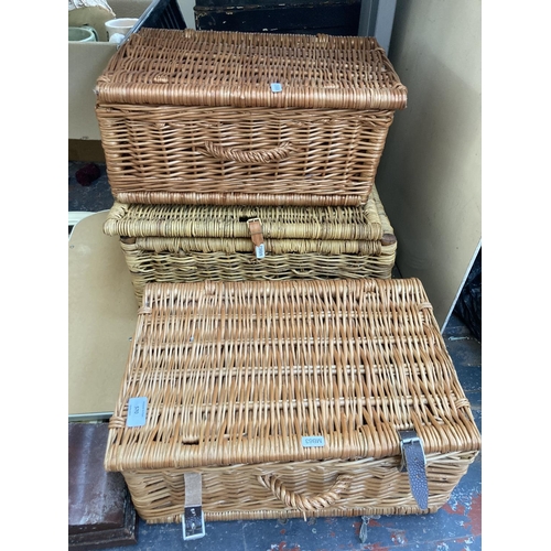 570 - Five items, three wicker baskets, one Edwardian mahogany cased mantle clock and one three-section dr... 