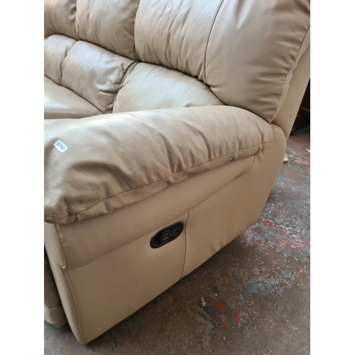 246B - A modern beige leather three seater reclining sofa