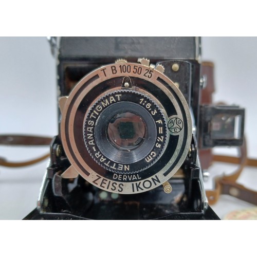 217 - A cased late 1930s Zeiss Ikon Nettar 515 self-erecting folding camera for 120 film fitted with Netta... 