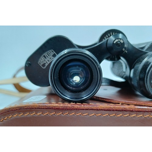 223 - A cased pair of Carl Zeiss Jenoptem 8 x 30w binoculars