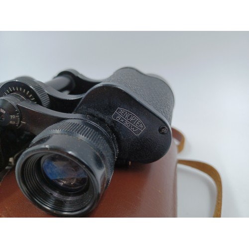 223 - A cased pair of Carl Zeiss Jenoptem 8 x 30w binoculars