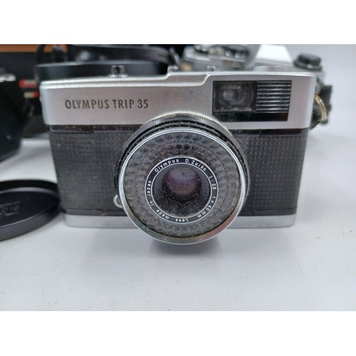 232 - Four Olympus items, one cased Camedia E-10 4mp digital camera, one cased OM-10 35mm SLR camera fitte... 